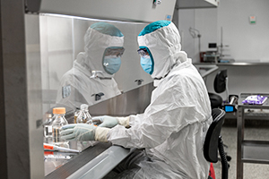 Pace® Life Sciences Scientist running tests in clean environment. Pace Life Sciences Laboratory