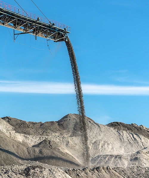 mining conveyer pouring rock into pile at gravel pit. Fracking, Bedrock rock, Mining Waste, Mining Overburden, Waste Rock