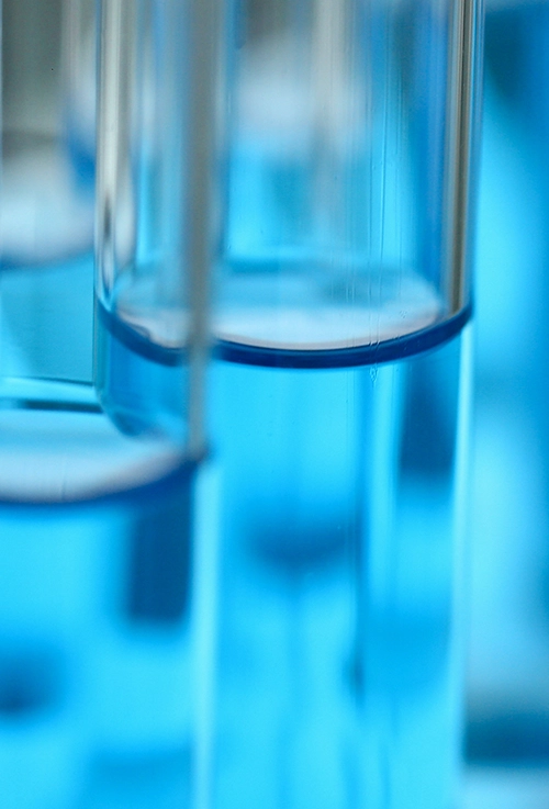 very closeup shot of test tube full of blue liquid. Fracking, Bedrock rock, Mining Waste, Mining Overburden, Waste Rock