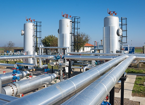 Oil refinery on a sunny day with blue sky. Petroleum contamination, Petroleum contaminants, Petroleum hydrocarbon forensics, Petroleum hydrocarbons, Total Petroleum hydrocarbons