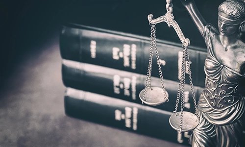 scales of justice in front of law books. Herbicides, What is an herbicide? Herbicides and pesticides