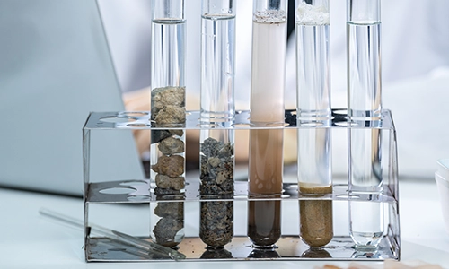 Test tubes in laboratory containing soil, water and other media. Herbicides, What is an herbicide? Herbicides and pesticides