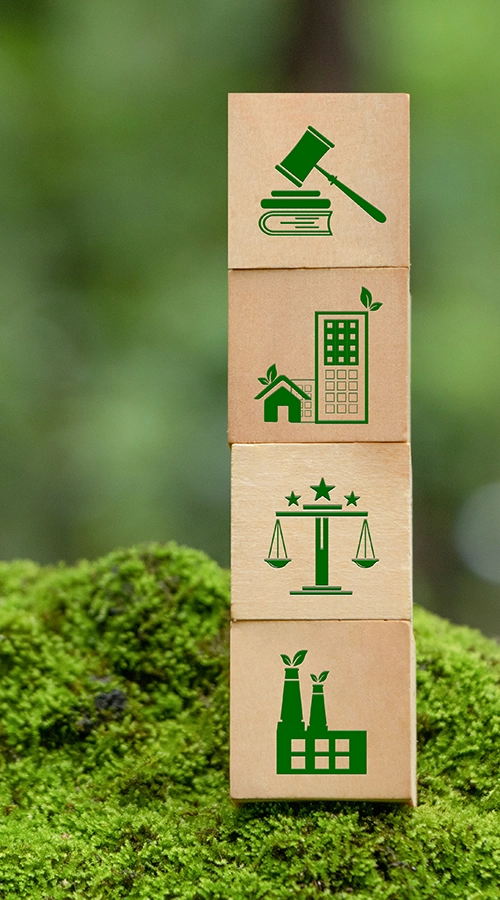 wooden blocks with environmental law icons stacked up on mossy background. Mercury testing, low level mercury analysis, low level mercury sampling
