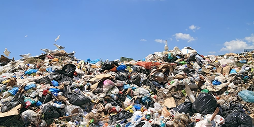 garbage in landfill against blue sky. TCLP, TCLP test, hazardous waste characterization, TCLP metals, What is a TCLP test