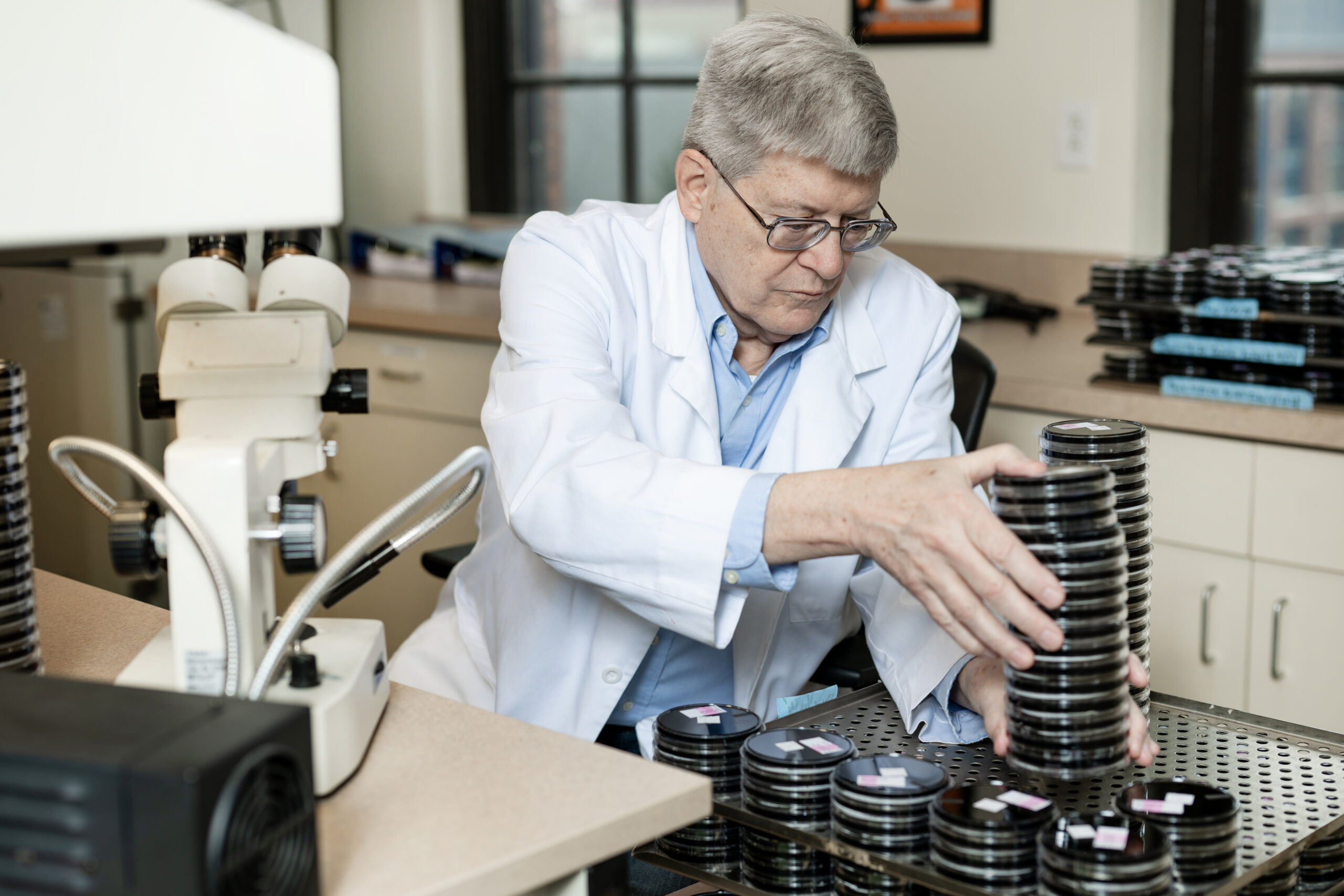 Pace Scientist identifying Legionella cultures on media.